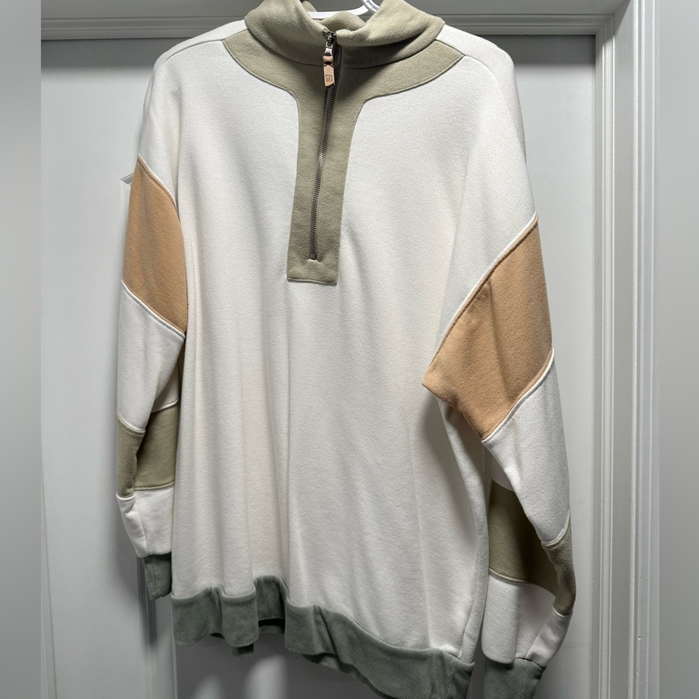 White Zip up with green and orange coloring Sweater